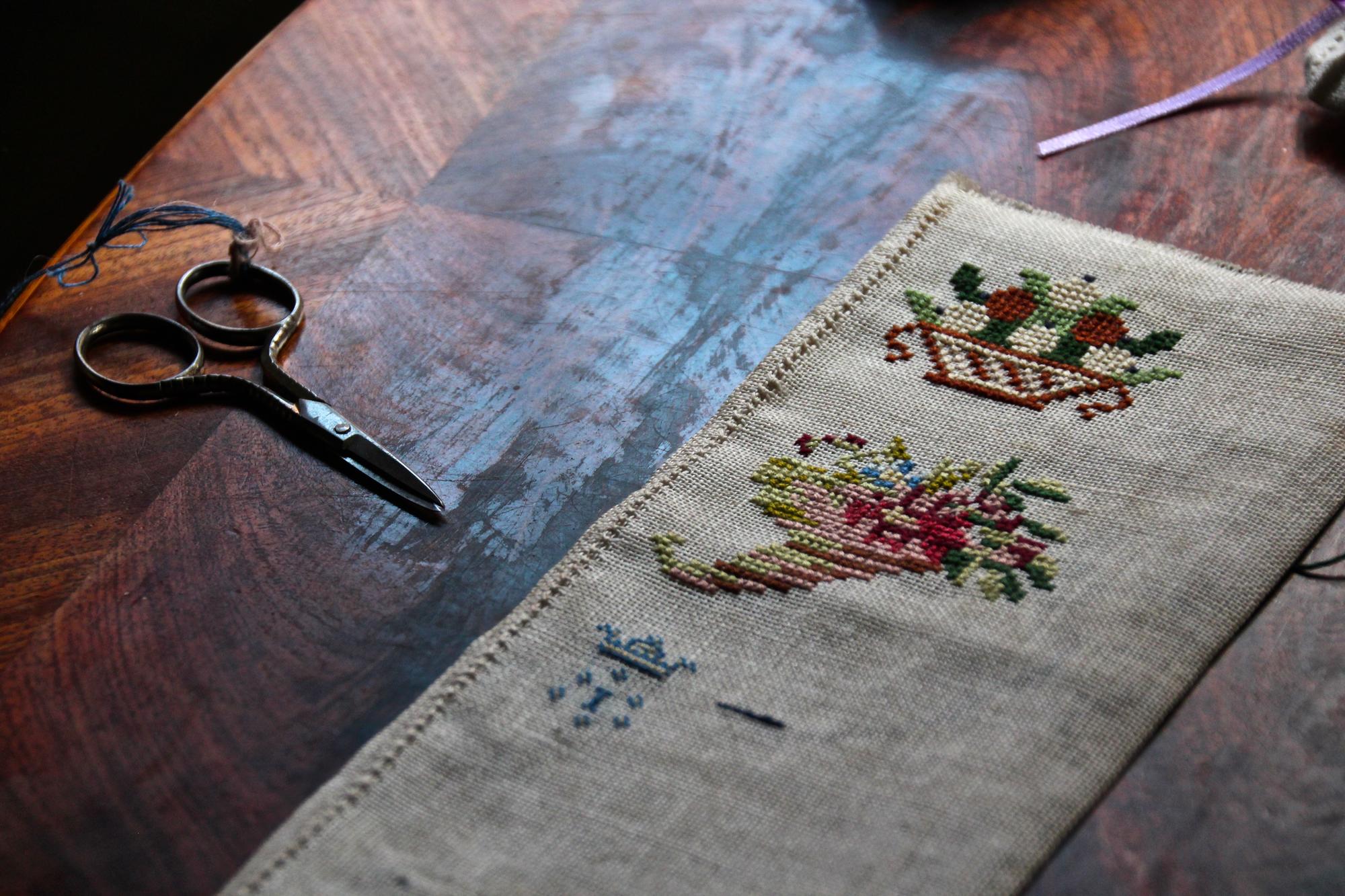 Selection of embroidered samples on table